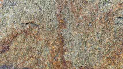 Cracked granite stone texture. Granite rock surface. Natural stone backdrop