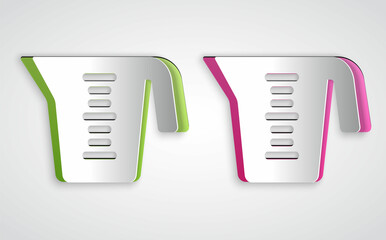 Paper cut Measuring cup to measure dry and liquid food icon isolated on grey background. Plastic graduated beaker with handle. Paper art style. Vector