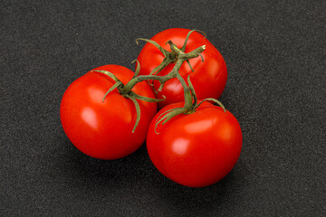 Red bright ripe tomato branch