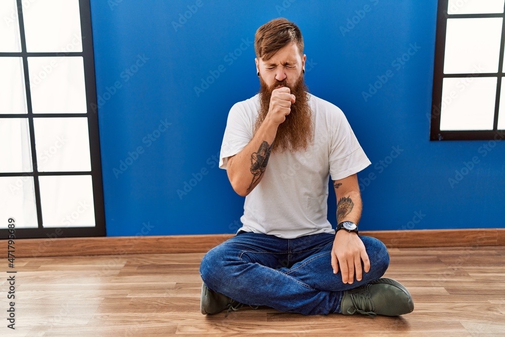 Canvas Prints Redhead man with long beard sitting on the floor at empty room feeling unwell and coughing as symptom for cold or bronchitis. health care concept.