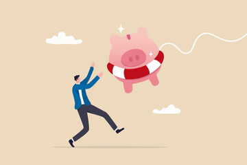Emergency fund or money to help in crisis situation, savings for unexpected expense or losing job, emergency loan concept, happy businessman catching piggybank with lifebuoy as life support in crisis.