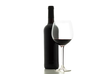 isolate glass of red wine and bottle on white background