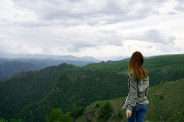 Naklejka premium Woman tourist mountains travel landscape nature vacation