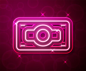 Fototapeta premium Glowing neon line Stacks paper money cash icon isolated on red background. Money banknotes stacks. Bill currency. Vector