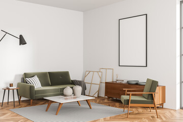 Corner view of white and green living room with canvas