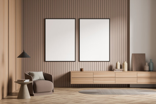 Light guest room interior with armchair and drawer, mockup posters