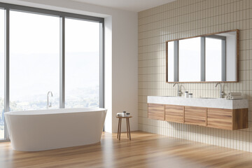 Fototapeta na wymiar Wooden bathroom interior with sink and mirror, bathtub near window