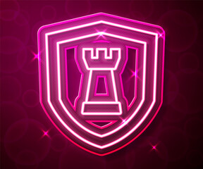 Glowing neon line Chess shield icon isolated on red background. Business strategy. Game, management, finance. Vector