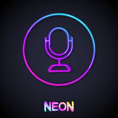 Glowing neon line Microphone icon isolated on black background. On air radio mic microphone. Speaker sign. Vector