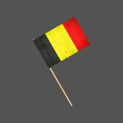 Belgium grunge flag on a stick. Isolated on a gray background. Design element. Signs and Symbols.