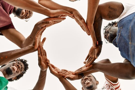 Group of young african american artist man smiling happy doing circle with hands together at art studio.