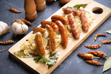 Grilled german sausage links with sauerkraut