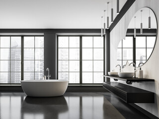 Freestanding bathtub in white and grey bathroom