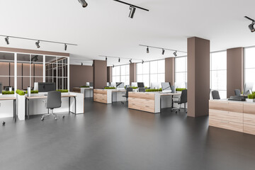 Dark open space interior with armchairs and pc on concrete floor, windows