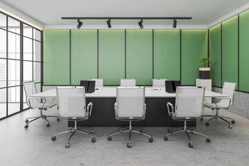 Green conference room interior with furniture and windows