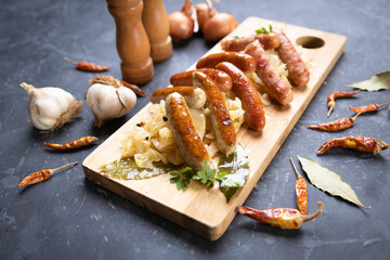 Grilled german sausage links with sauerkraut