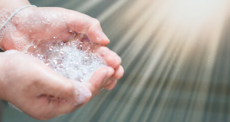 hand hold bubbles in palm with light
