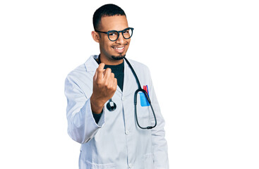 Young african american man wearing doctor uniform and stethoscope beckoning come here gesture with hand inviting welcoming happy and smiling