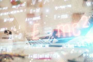 Double exposure of woman hands typing on computer and formula hologram drawing. Education concept.