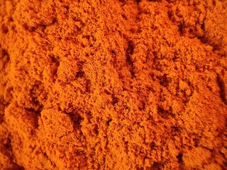 Close up of red chili powder,  chili powder texture, red paprika background