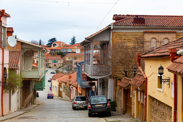 Fototapeta na wymiar Spring view of Signagi township located on hillside with narrow winding streets paved with cobblestones and colorful houses, Kakheti region, Georgia