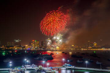 fantastic and colorful fireworks display over the night sky of the city during a festival