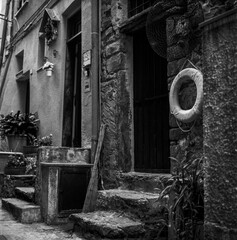 The narrow alley in Vernazza in the Cinque Terre in Italy shot with black & white film technique