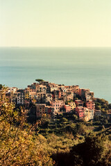 Fototapeta na wymiar Approaching the village of Corniglia in the Cinque Terre in Italy in a summer afternoon, shot with analogue film technique