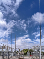 high voltage electrical power substation and blue sky - obrazy, fototapety, plakaty