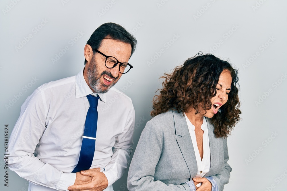 Sticker Middle age couple of hispanic woman and man wearing business office uniform with hand on stomach because nausea, painful disease feeling unwell. ache concept.