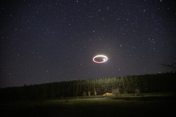 flying a quadcopter at night in the starry sky