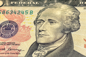 Close-up of 10 us dollar bill. Portrait of Alexander Hamilton on the ten us dollars banknote.