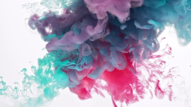 Mix of pink lilac and blue paints swirls in transparent liquid as decorative abstract background slow motion extreme close view