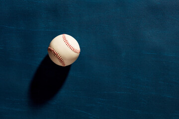 Baseball ball on dark moody blue background
