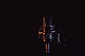 Professional microphone in pink smoke on a black background.