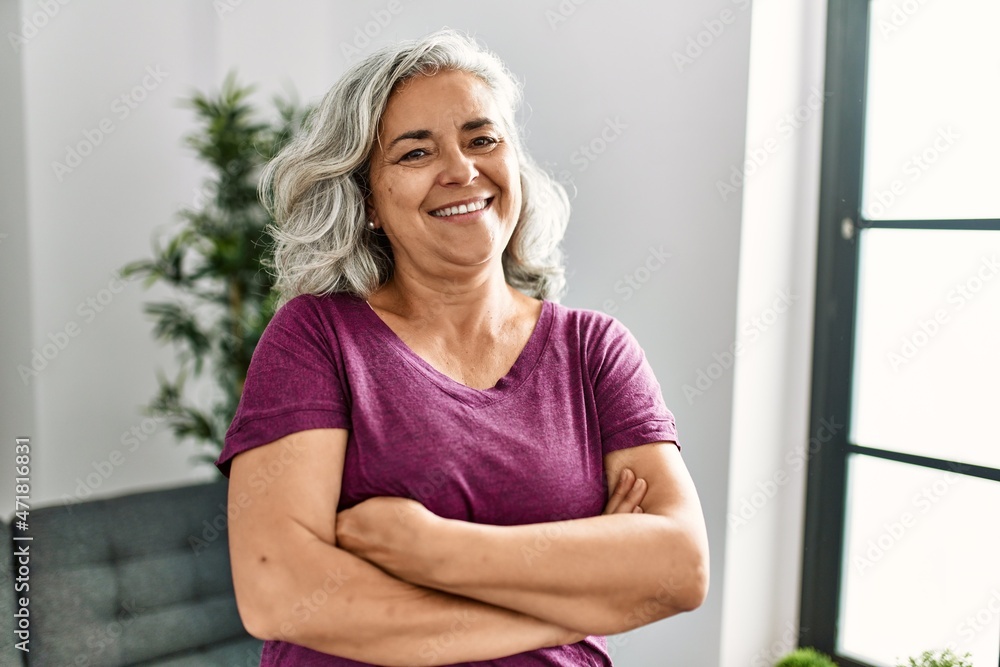 Sticker middle age grey-haired woman smiling happy standing with arms crossed gesture at home. - Stickers