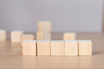 wooden cube on wooden table, mockup, template, copy space for text