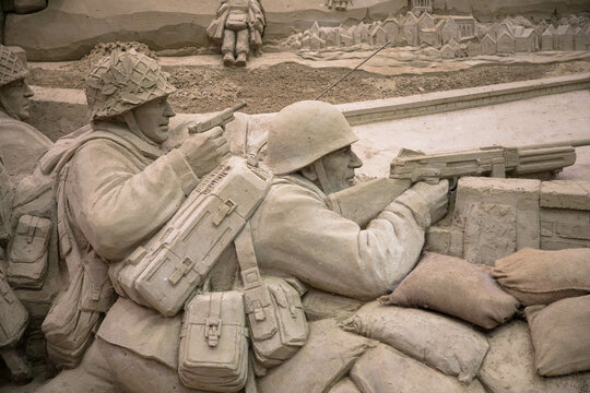 Sand sculptures in the Arnhem Open Air Museum Garderen cultural park. Insights into the Second World War. Battlefield with soldiers. Garderen, Gelderland, Netherlands, September 20, 2021.