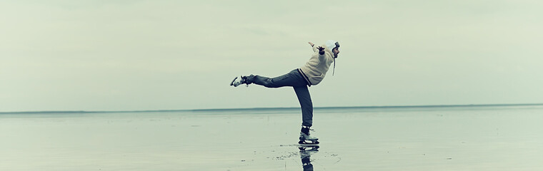 one guy skates on the ice of a frozen lake, nature landscape, man outdoor sports