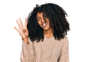 Young african american girl wearing casual clothes showing and pointing up with fingers number four while smiling confident and happy.