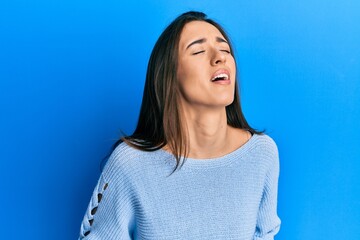 Young hispanic girl wearing casual clothes with hand on stomach because nausea, painful disease feeling unwell. ache concept.