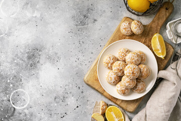 Lemon gingerbread in a white plate on a light gray culinary background. Delicious homemade cookies top view. Copyspace