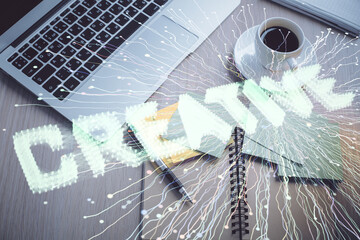 Start up theme drawing over computer on the desktop background. Top view. Double exposure....