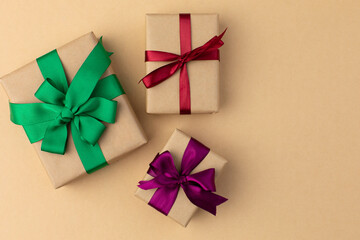 Gift boxes wrapped in craft paper with ribbon and bow