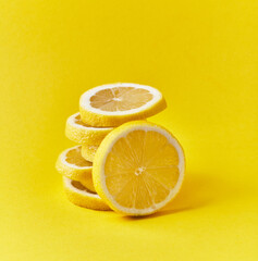  Slices of lemon on a yellow background