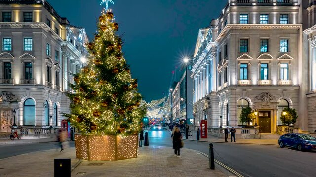 Evening time lapse view of the beautiful christmas decorated city center with Waterloo Place and lower Regent Street, London