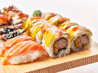  Wooden board of sushi food isolated on white background