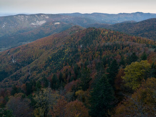 Fototapeta premium Viewpoint Sjenic in Tara National Park, view of the village in the valley and forested mountains in Serbia