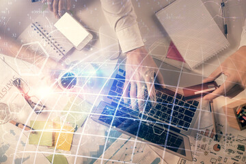 Double exposure of man and woman working together and world map hologram drawing. international network concept. Computer background. Top View.