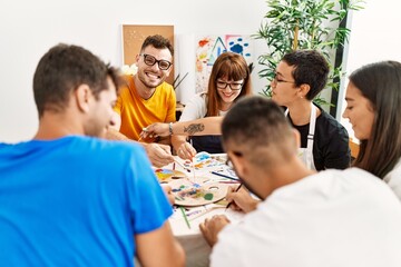 Group of people drawing at art studio.